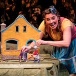 Actor, Autumn Ness, performs The Biggest Little House in the Forest at Children's Theatre Company alongside 2 puppets (a mouse and a butterfly)
